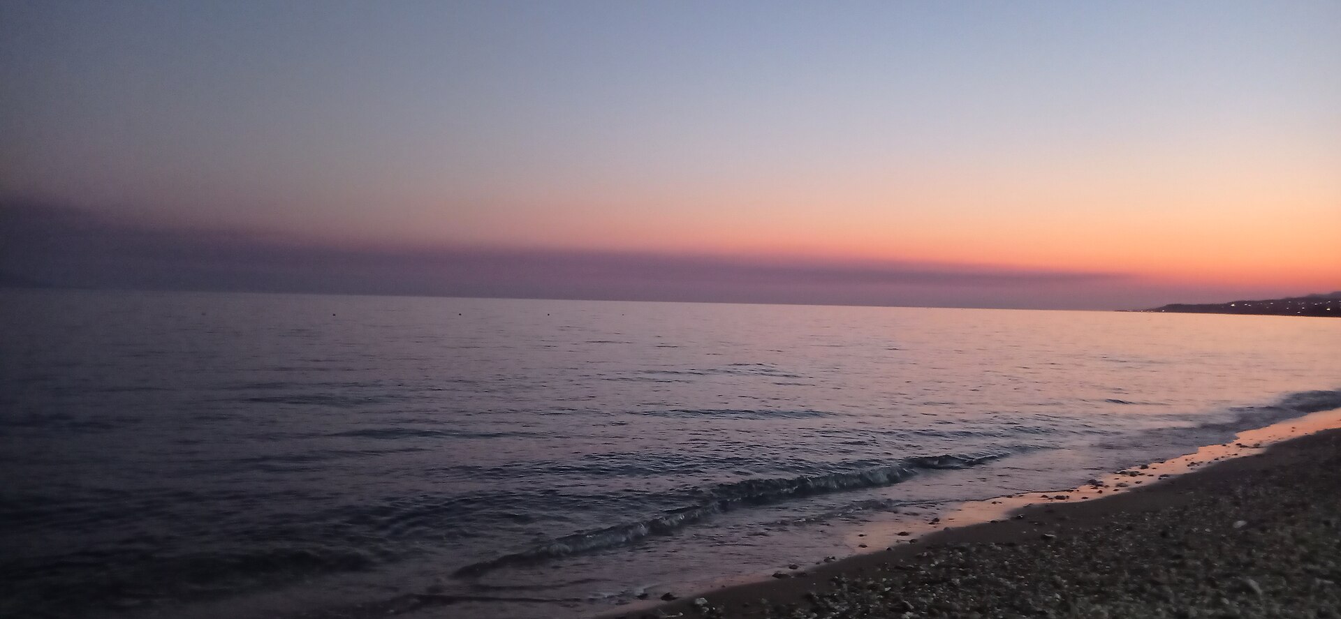 Silhouettes on an Alexandroupolis beach at sunset